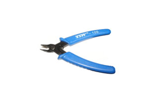 A wire cutter being used to cut electrical wires cleanly and precisely.